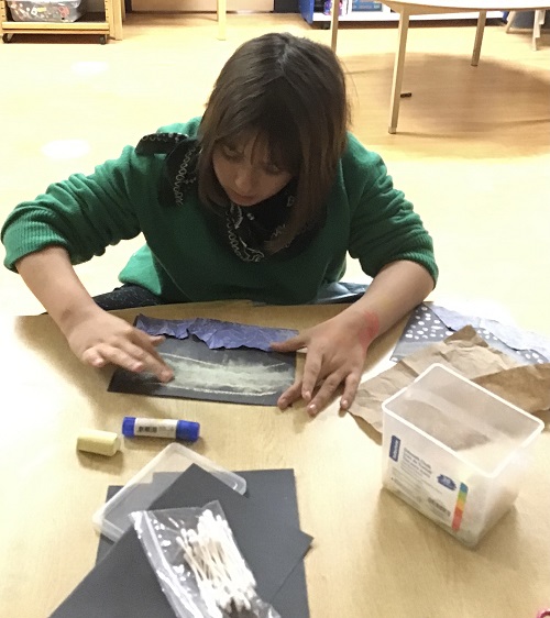child sitting at a desk
