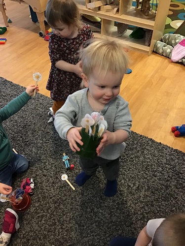 child holding object