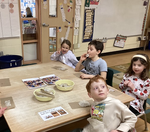group of children trying the dumplings