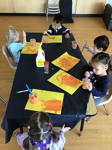 Toddlers painting fire and flames