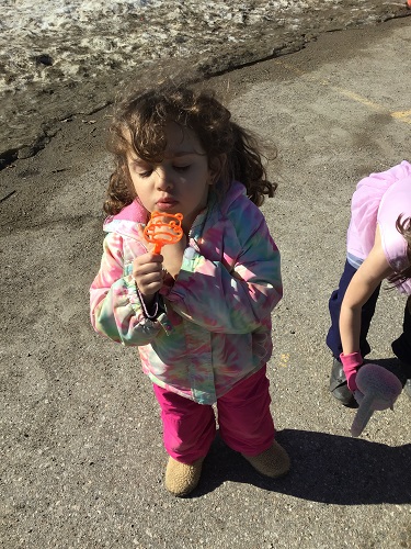 A child blowing bubbles