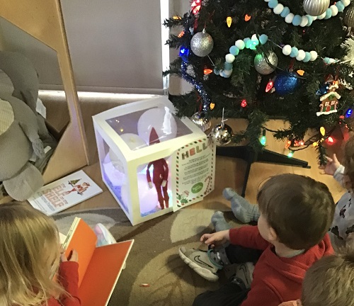 Preschool children welcome their elf