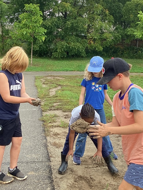 School age children exploring nature