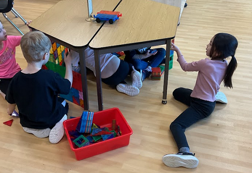 multiple children under the table