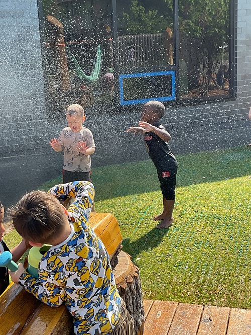 children getting strayed with a hose