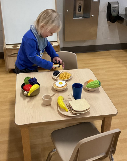 child setting the table