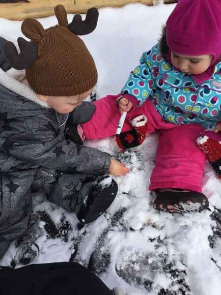infants playing in the snow