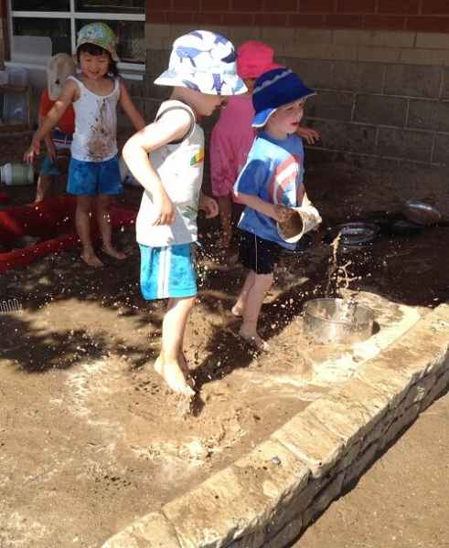 children playing in mud