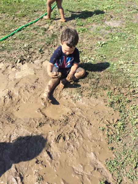 children playing in mud