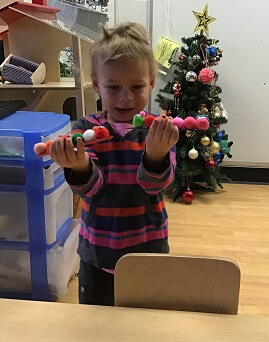 boy holding home made caterpillars