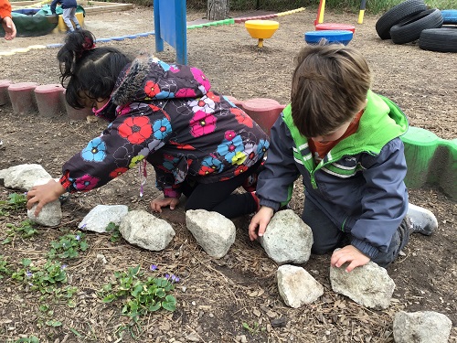 Children looking for worms