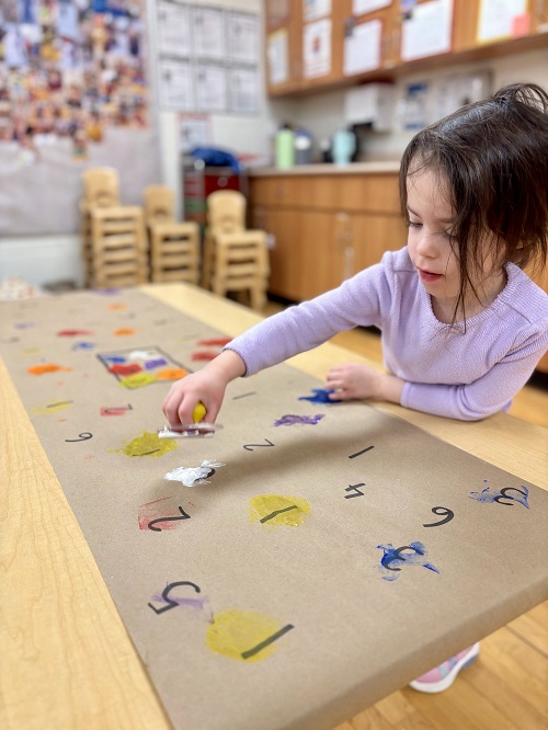 child working to identify numbers