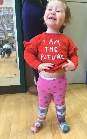 girl proudly showing her socks