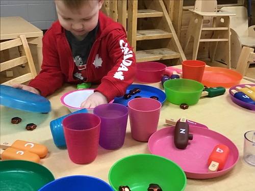 Child pretending to serve food.