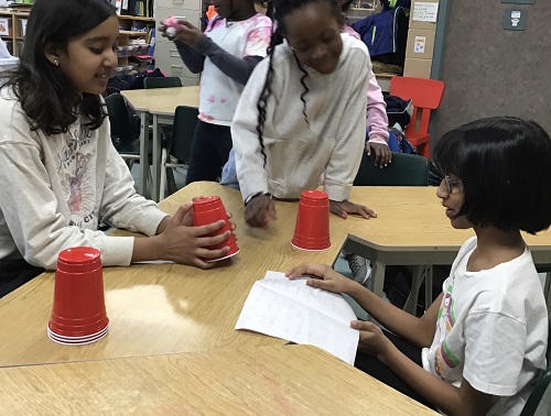 Children playing with solo cups.