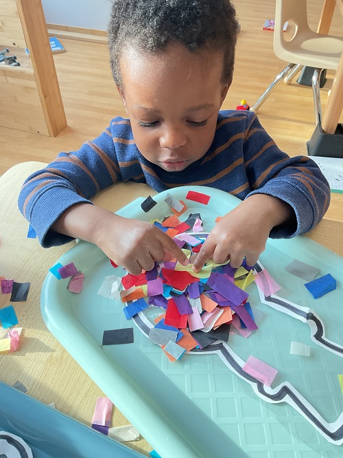 child at the craft table