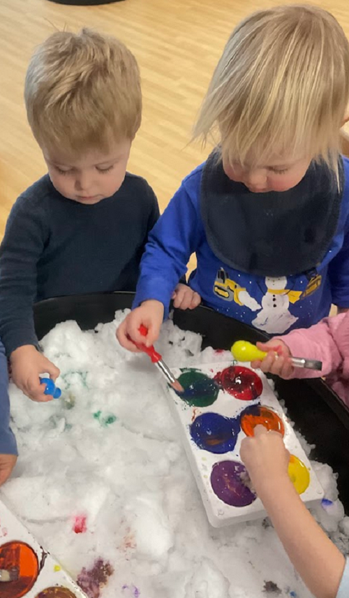 2 children, water paint and snow